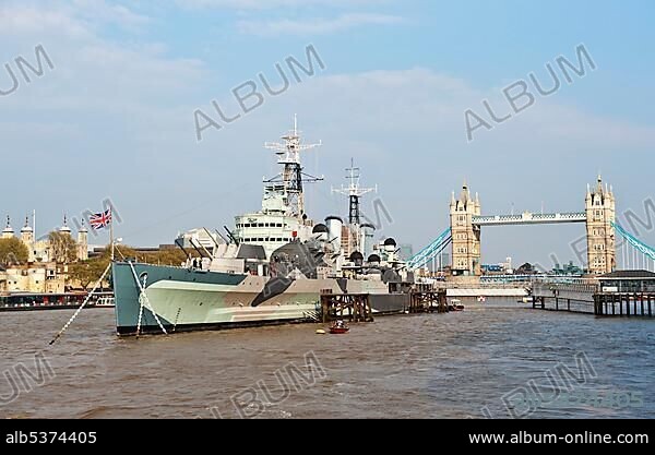 Museum ship HMS Belfast, built 1938, on the River Thames with the Tower of London and Tower Bridge at back, London, England, United Kingdom, Europe.