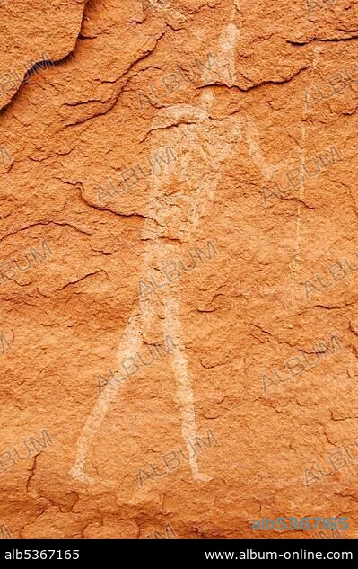 Painted human, man, neolithic rock art of the Tadrart, Tassili n'Ajjer National Park, Unesco World Heritage Site, Algeria, Sahara, North Africa, Africa.