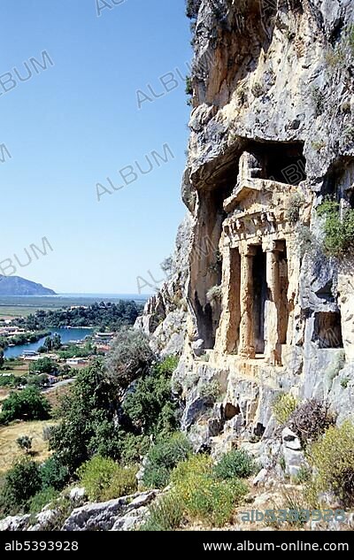 Ancient grave, Lycian rock-cut tomb in a cliff face by a river, river delta near Kaunos, Dalyan in the Mugla Province, Turkey, Asia.