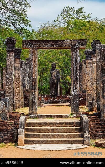 Standing Buddha statue in ancient ruins, Socalled Quadrangle, ancient city Polonnaruwa, famous tourist attraction, Sri Lanka, Asia.