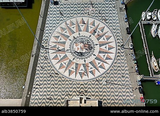 Large compass in the paving in front of the Monumento a Los Descubrimientos, Monument to the Discoveries, Belém, Lisbon, Lisbon District, Portugal, Europe.