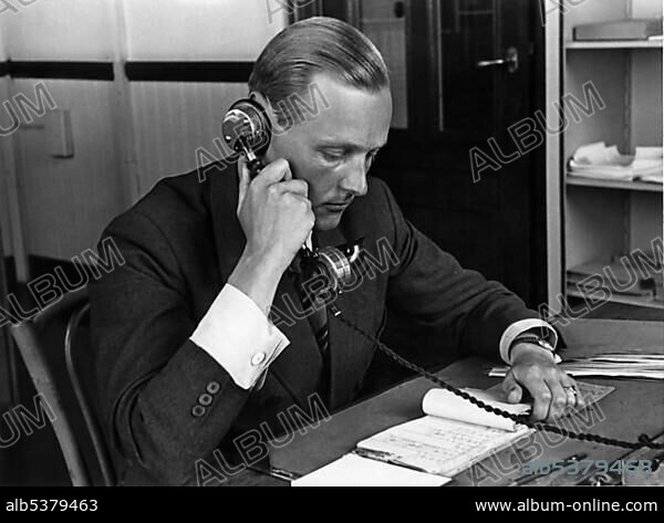 Man phoning in his office, historic picture from about 1940.
