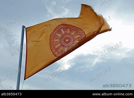 Buddhist flag with the wheel Dharmacakra or Dharmachakra, symbol for BuddhaÂ´s teachings, Bangkok, Thailand, Asia.