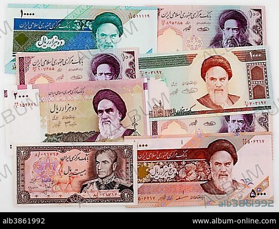 Various historic bank notes from Iran with portraits of Shah Mohammad Reza Pahlavi and Ruhollah Khomeini.
