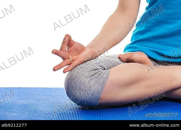 Close up of yoga Padmasana (Lotus pose) cross legged position for meditation with Chin Mudra, psychic gesture of consciousness.