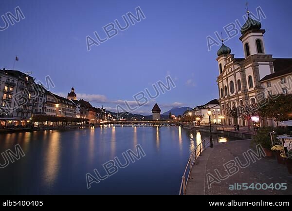 Jesuit Church, Reuss River and historic Kapell Bridge with Watertower, Lucerne, Switzerland, Europe.