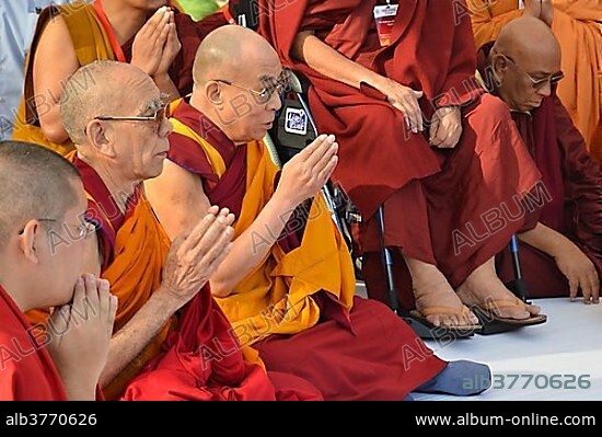 Buddhism, the Dalai Lama in a communal prayer with dignitaries, eg Karamapa, from all Buddhist branches and schools, gathering for meditation in Gandhi Smitri, Global Buddhist Congregation 2011, New Delhi, India, Asia.