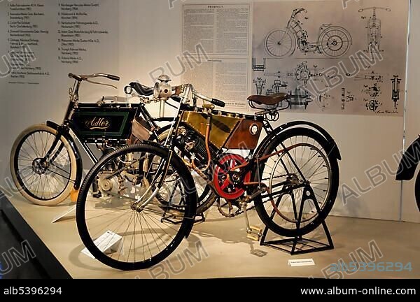 Hildebrand & Wolfmueller motorcycle in front of an Adler motorcycle, German Motorcycle and NSU Museum, Neckarsulm, Baden-Wuerttemberg, Germany, Europe.