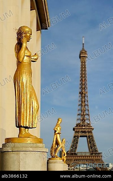 Golden statues at the Palais de Chaillot with the Eiffel Tower, Place du Trocadero, 16th Arrondissement, Paris, France, Europe.