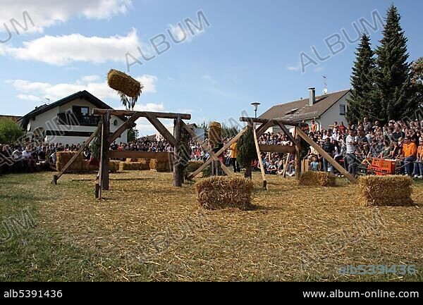 Discipline sheaf toss over an obstacle, Highland Games in Kreenheinstetten, Sigmaringen district, Upper Swabia, Baden-Wuerttemberg, Germany, Europe.