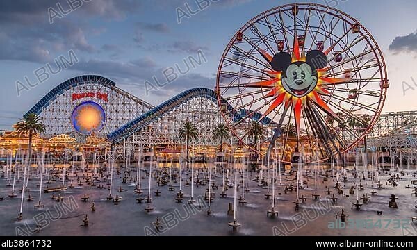 Ferris Wheel Mickey's Fun Wheel and Roller Coaster California Screamin', in front Lake Paradise Bay with water fountains, California Adventure Park, Disneyland Resort, Anaheim, California, USA, North America.