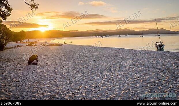 Sunset view of Whitehaven beach at Whitsunday Island in Queensland, Australia. Whitehaven beach is a well known landmark known for its beautiful white sand and clear turquoise wates.