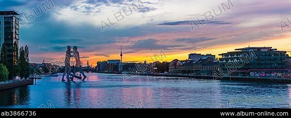 Molecule Man, monumental artwork by Jonathan Borofsky by Jonathan Borofsky, River Spree, TV Tower, sunset, Treptow, Berlin, Germany, Europe.