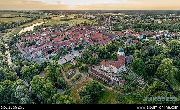Panorama aerial view of village Lenzen and river Loecknitz (Löcknitz) at sunset, Brandenburg, Germany, Europe.