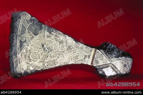 Viking art. The great axe from Mammen, Jutland. The design, inlaid with silver wire, depicts a bird-animal with limbs like acanthus and spiralling thighs.. 10th century. Copenhagen, National museum.
