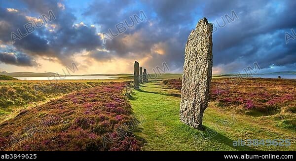 The standing stones of the Ring of Brodgar, neolithic henge and stone circle at sunset, Mainland Orkney, Scotland, United Kingdom, Europe.