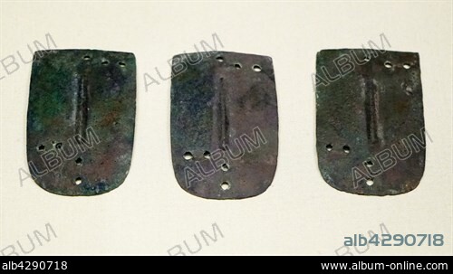 Ancient Assyrian scale armour made from segments of copper alloy. Dated 8th Century BC.