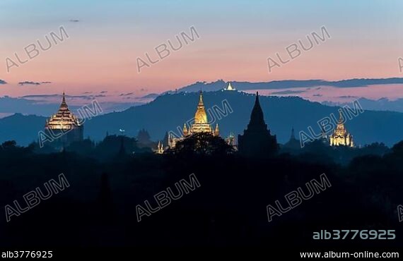 View of Thatbyinnyu temple, Ananda temple and other temples at dusk, Old Bagan, Myanmar, Asia.