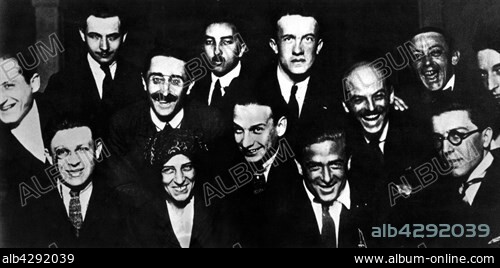Journalists at the magazine "391". . In the first row, from the l. to the r.: Tristan Tzara, Céline Arnauld, Francis Picabia and André Breton. In the 2nd row, from the l. to the r.: Benjamin Péret, Paul Dermée, Philippe Soupault, Georges Ribemont-Dessaignes. In the 3rd row, from the l. to the r. : Louis Aragon, Fraenkel, Paul Eluard, Clément Pansaers, and Bernard Fay.. 1921. France.