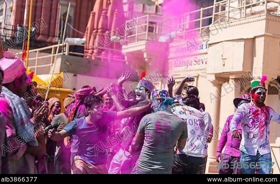 People throwing colored powder, Holi Festival, Varanasi, Uttar Pradesh, India, Asia.