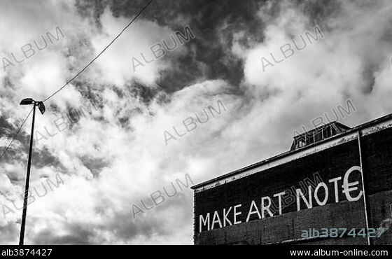 Lettering "Make Art not Euro" on the facade of the Ij-halls, Amsterdam, The Netherlands, Europe.