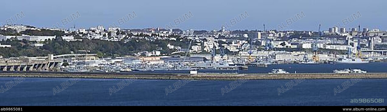 Panoramic view over German WW2 U-boat submarine pen and French Navy ships docked in the port, harbour of the city Brest, Finistère, France, Europe.