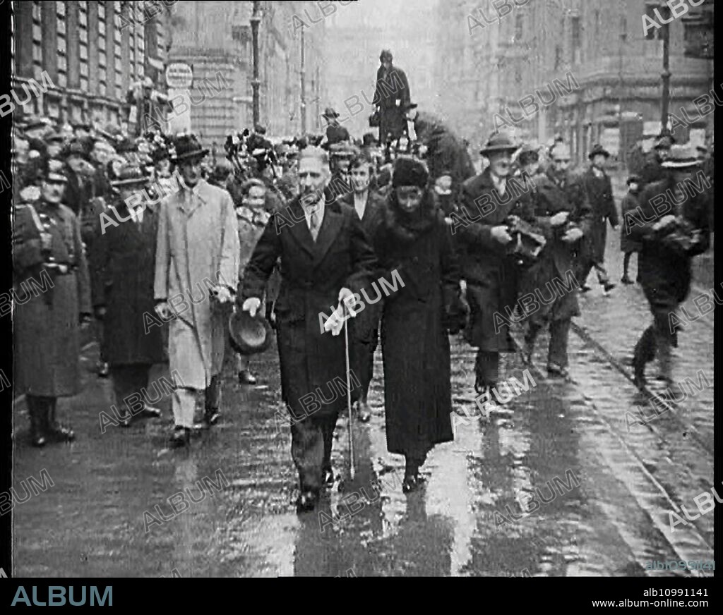 Franz von Papen Walking Towards Camera Surrounded by a Crowd, 1933. The rise of Nazism. 'And even conservative Von Papen didn't exactly say no [to the National Socialist Party]. But then Von Papen hardly said no to anyone'. From "Time To Remember -  The Time Of The Monster", 1933  (Reel 2); documentary film about events of 1933, rise of Roosevelt and Hitler.