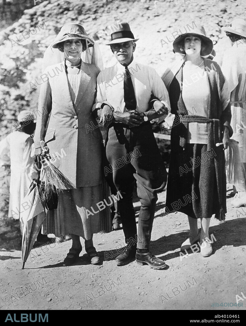 Visitors to the Tomb of Tutankhamun, Valley of the Kings, Egypt, 1923. Left to right: Lady Somerleyton, Colonel Watson Pasha and the Hon Lady Alexander. The discovery of Tutankhamun's tomb in 1922 by British archaeologist Howard Carter (1874-1939) was one of the most astounding discoveries in archaeology. Tutankhamun was a previously unknown pharaoh whose name had been eradicated from historical records by one of his successors because of his association with the heretical pharaoh Akhenaten, who was Tutankhamun's father-in-law. Consequently his tomb, uniquely, had remained undisturbed by grave robbers.