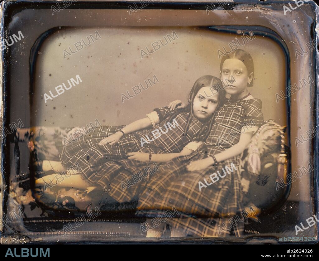 [Portrait of two girls reclining on chaise lounge]; Sheldon K. Nichols, American, active 1850 - 1854; 1851 - 1854; Daguerreotype, hand-colored; 1/2 plate, Image: 8.3 x 11 cm (3 1/4 x 4 5/16 in.), Plate: 10.6 x 13.8 cm (4 3/16 x 5 7/16 in.), Mat: 10.8 x 14 cm (4 1/4 x 5 1/2 in.).