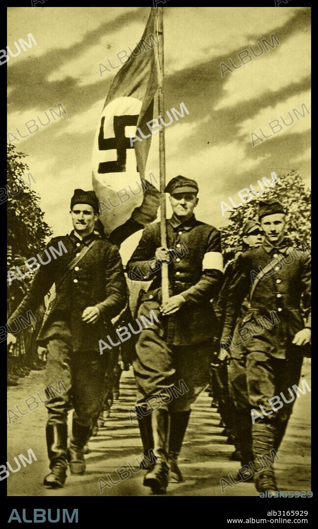 German soldiers march through the streets of Warsaw, flying the Nazi flag. Poland's captial was invaded and surrendered in 1939, to the German forces.