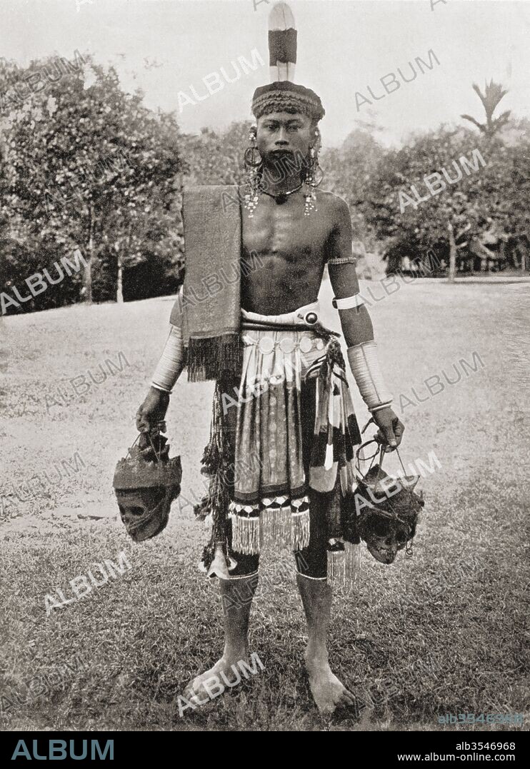 A Dayak, Dyak or Dayuh man from the island of Borneo, seen here in gala costume. Every year or two the Dayaks hold a feast called Gawai Autu in honour of the departed spirits which they believe surround the heads which hang in their houses. After a 19th century photograph. From Customs of The World, published c.1913.