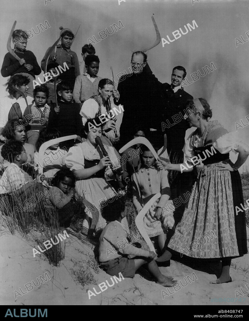 Trapp Family Singers... Using a Boomerang as her Baton.Baroness Maria Augusta von Trapp. The mother of the famous family Trapp singers, leading some of her family with some happy little ABC children in singing Waltzing Matilda. On the La Perouse Beach.The Trapp family played their recorders and sung with the children. After the children and other Senior Abos had taught them to through boomerangs.The famous Trapp family have their first concert at the conservatorium of Thurs. August 17, 1955. (Photo by Gordon Herbert Short/Fairfax Media).