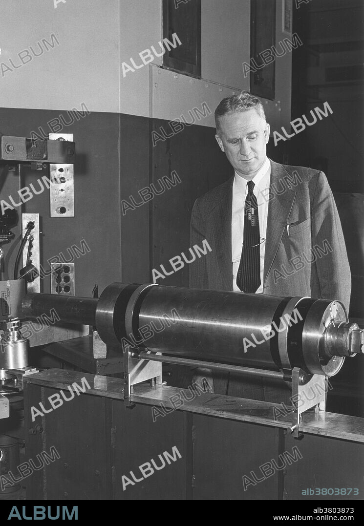 Walter Zinn observing a CP-5 crystal spectrometer. Chicago Pile-5 was the last of the line of Chicago Pile research reactors which started with CP-1 in 1943. CP-5 operated from 1954-1979. It was a thermal-neutron reactor using enriched uranium as fuel and heavy water as coolant and as a neutron moderator. It produced neutrons for use in research. Cleanup and decommissioning of the site of CP-5 was completed in 2000. Walter Zinn (1906-2000) was a Canadian-born nuclear physicist who worked on the Manhattan Project, was a director of the Argonne National Laboratory from 1946-1956, and developed and built several new reactor designs. Researchers working on CP-5 at Argonne National Laboratory. Chicago Pile 5 (CP-5).