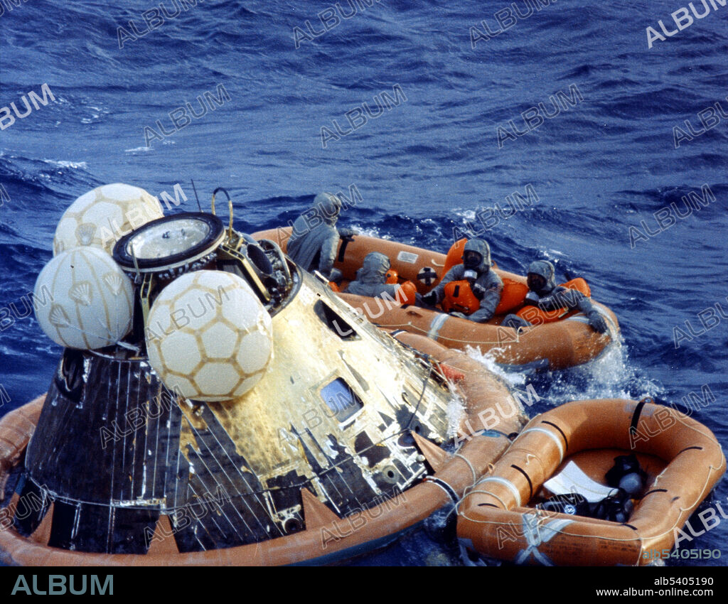 Recovery operation of the capsule in the Pacific Ocean after splashdown. Navy para-rescue men recovered the capsule housing the 3-man Apollo 11 crew. The crew was taken to safety aboard the USS Hornet, where they were quartered in a mobile quarantine facility. With the success of Apollo 11, the national objective to land men on the Moon and return them safely to Earth had been accomplished. Apollo 11 was the spaceflight that landed the first two people on the Moon. Commander Neil Armstrong and lunar module pilot Buzz Aldrin landed the Apollo Lunar Module Eagle on July 20, 1969. Armstrong became the first person to step onto the lunar surface six hours later on July 21; Aldrin joined him 19 minutes later. They spent about two hours together outside the spacecraft, and collected 47.5 pounds of lunar material to bring back to Earth. Command module pilot Michael Collins flew the command module Columbia alone in lunar orbit while they were on the Moon's surface. Armstrong and Aldrin spent 21.5 hours on the lunar surface before rejoining Columbia in lunar orbit.
