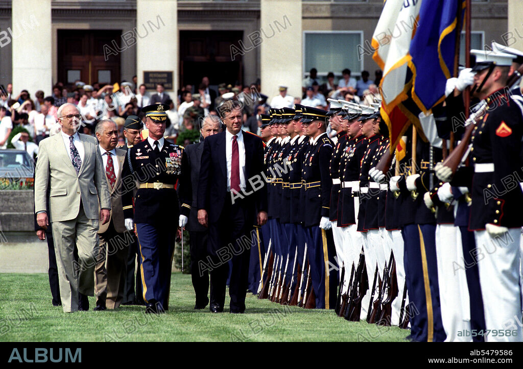First row, left to right: the Honorable Secretary of Defense Les Aspin, Commander of Troops, the Honorable Bruce Babbitt, Secretary of the Interior.  Second Row, left to right: Individual unknown, the Honorable Marvin Runyon, Postmaster General, United States Postal Service.  Third row, General Colin Powell, Chairman, Joint Chief of Staff, pass through an honor cordon.