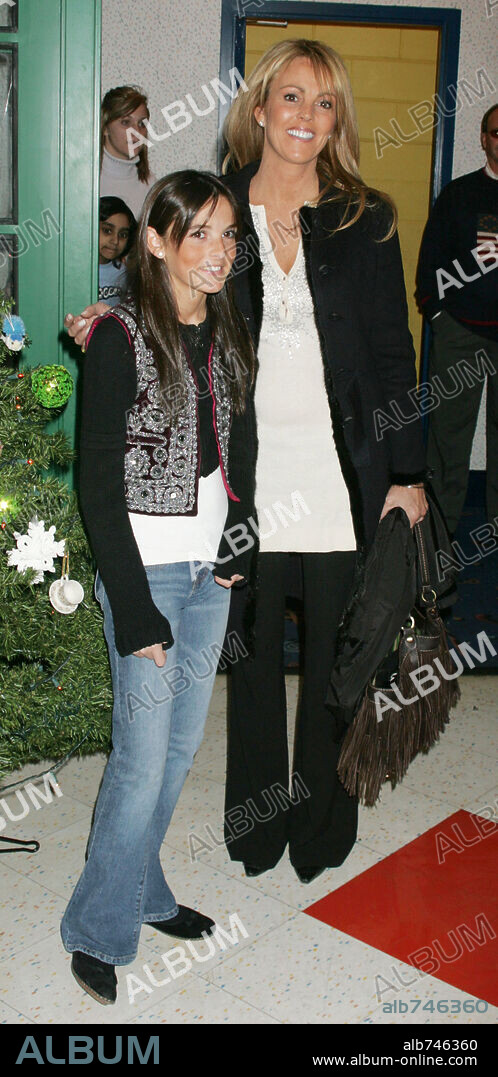 DINA LOHAN and ALISON LOHMAN. Dec 07, 2005; New York, NY, USA; ALI LOHAN, singer, actress and sister of Lindsay Lohan & her mother DINA, visits the Ronald McDonald House to bring Christmas cheer to children with cancer. Mandatory Credit: Photo by Nancy Kaszerman/ZUMA Press.(©) Copyright 2005 by Nancy Kaszerman. 07/12/2005