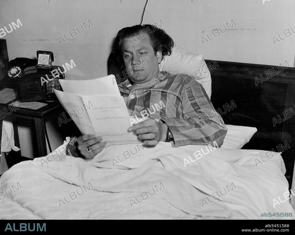 Rudolf Schock, German lyric tenor, anxious to improve his English listening eagerly to the A.B.C's session, "English for New Australians,".Schock opens his Australian season next Saturday night with Rafael Kubelik and the Sydney Symphony Orchestra. He will also give recitals at the Sydney Town Hall on June 13, 15, 18 and 20. June 27, 1949. (Photo by Visatone (Aust.) Pty. Ltd.).