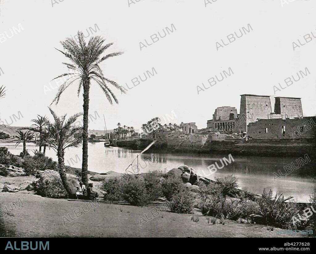 Temple of Isis, Philae, Egypt, 1895. First Pylon of the Temple of Isis, ancient Egyptian archaeological site on the river Nile. From "Round the World in Pictures and Photographs: From London Bridge to Charing Cross via Yokohama and Chicago". [George Newnes Ltd, London, 1895].