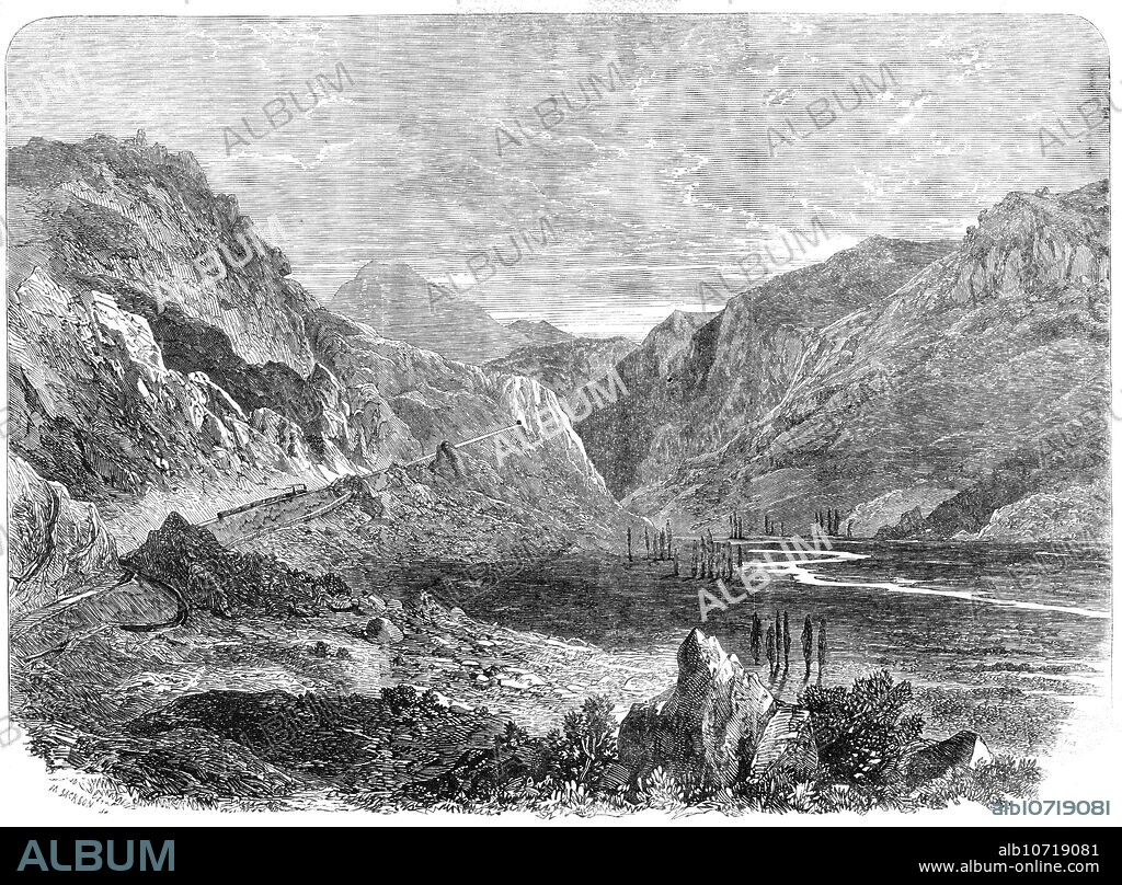 MASON JACKSON. The Valparaiso and Santiago Railway: the Tabon Incline, 1864. Engraving from a drawing by Mr. Boulet, a draughtsman '...of the Chilian Government, of...one of the highest railways in the world... Its length is somewhat over 114 miles, and, as its course lies through a portion of the Chain of the Andes, it offers, in some respects, features seldom encountered upon works of this nature...The passage of the mountain range of Tabon, between Valparaiso and the capital, was a very formidable undertaking, and in accomplishing this the chief difficulties have been surmounted. For some miles the line climbs along the face of precipitous cliffs, at a considerable height above their base, while above it tower rugged porphyry cliffs more than 1000 ft. in height, the favourite haunt of condors, eagles, and other bird of prey...A considerable portion of the funds employed upon the construction of this railway have been furnished from England through the house of Baring Brothers; and its total expense has exceeded two millions sterling...The railway...has been executed under the direction of Mr. Lloyd, formerly assistant of the late Robert Stephenson.' From "Illustrated London News", 1864.