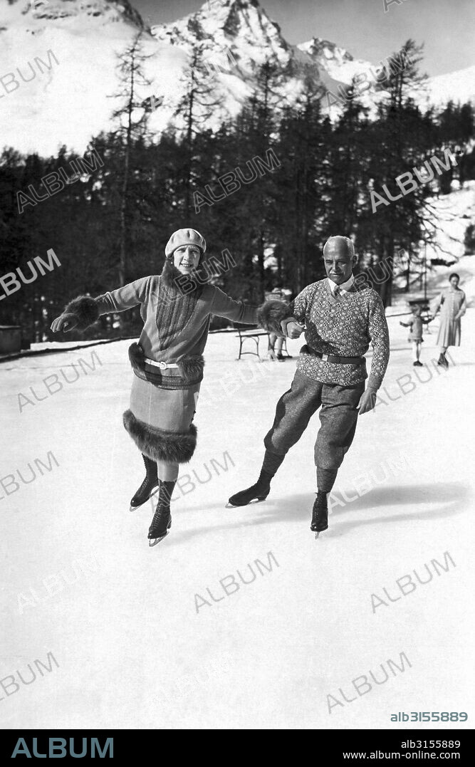 St. Moritz, Switzerland:  c. 1933. Sir Henri Deterding and Lady Deterding skating on the winter rinks of Suvretta House in St. Moritz. He is the chairman of the Royal Dutch Petroleum Company.