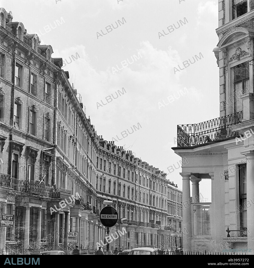 Hogarth Road, Earls Court, Brompton, London, 1964. Terraced houses on the south east side of Hogarth Road, Earls Court looking south west from Knaresborough Place.