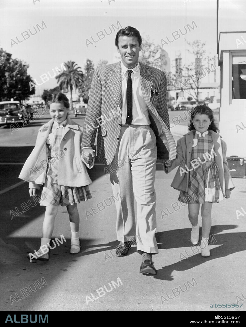 Sister To Assist Her -- When eight-year-old Noreen Corcoran began her film career at M-G-M, she had an excellent guide, elder sister Donna, who first clicked in "Angels in the Outfield." With Donna working in "My Mother and Mr. McChesney," Noreen made her debut in "Plymouth Adventure" and "I Love Melvin".2. Handsome Escort... Peter Lawford (back from English location of "Hour of Thirteen") gladly takes the girls in tow. May 1, 1953.