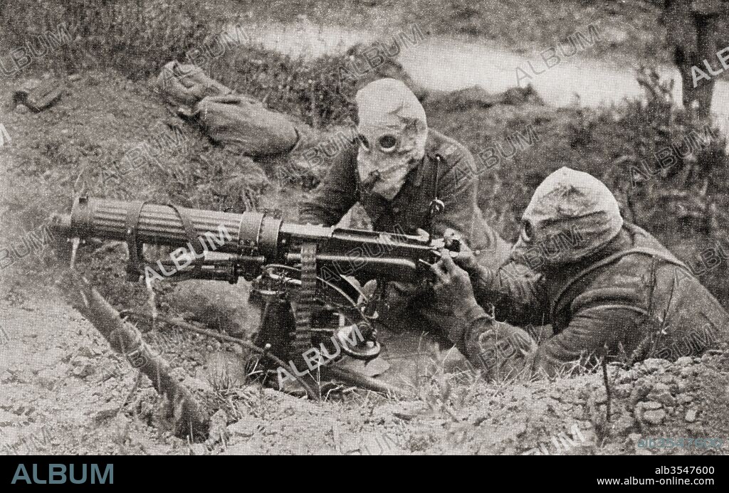 Machine gunners wearing masks to protect them from gas attacks during WWI. From The Story of Twenty Five Years, published 1935.