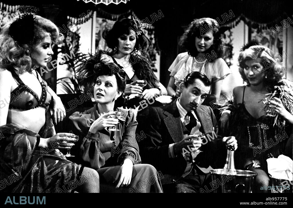JOSE SACRISTAN, SANDRA ALBERTI and SILVIA TORTOSA in NIÑAS... AL SALON, 1977, directed by VICENTE ESCRIVA. Copyright IMPALA FILMS.