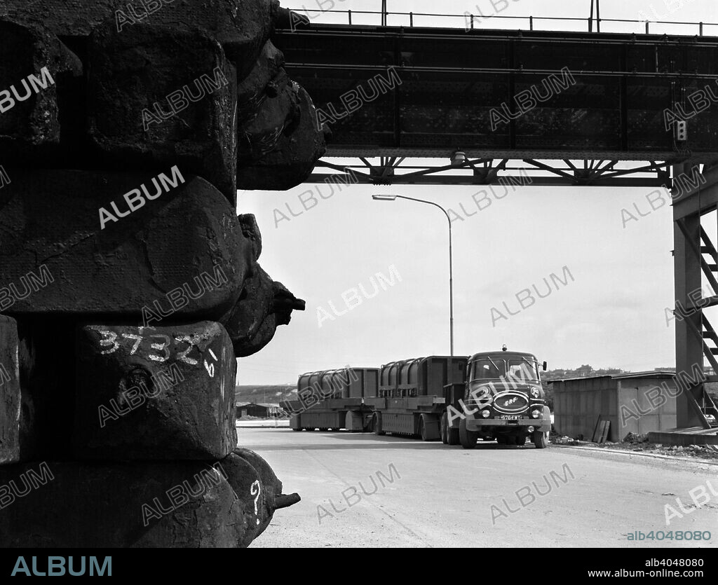 ERF 66GSF tipper pulling a hot ingot transporter, Rotherham, South Yorkshire, 1963. The lorry had a 13ft 3in wheelbase and was powered by the Gardner power unit. This particular tipper belonged to the Park Gate Iron and Steel Company and was photographed pulling the hot ingot transporter at their foundry.