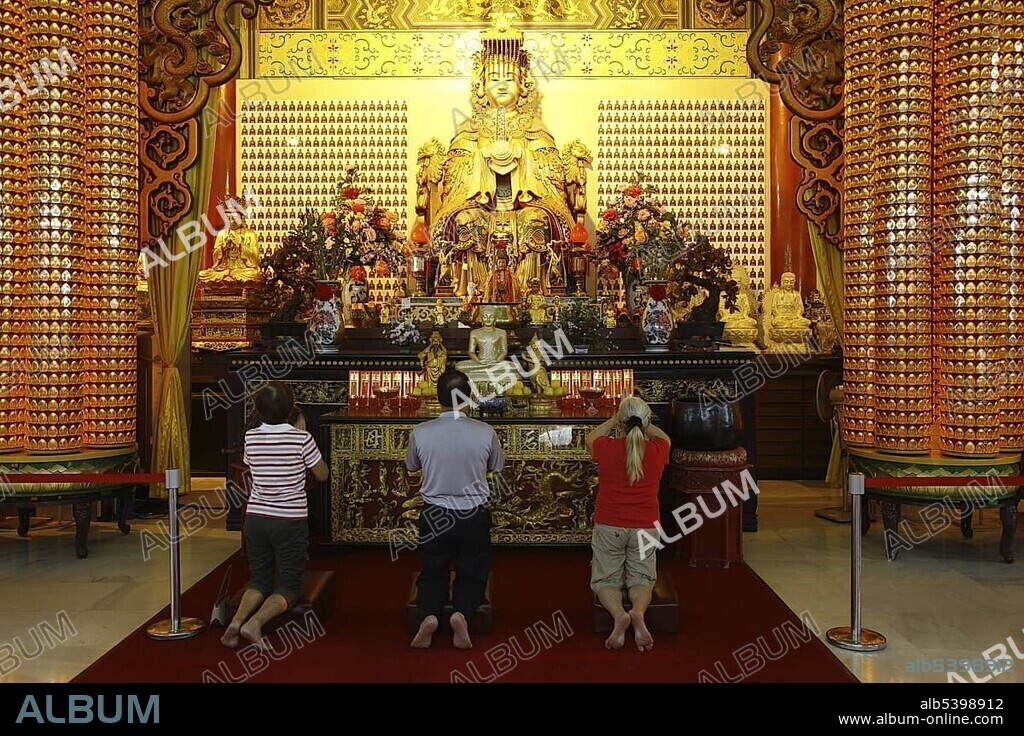 Praying people in front of the statue of Mazu, tutelary goddess, Chinese Thean Hou Temple, Kuala Lumpur, Malaysia, Asia