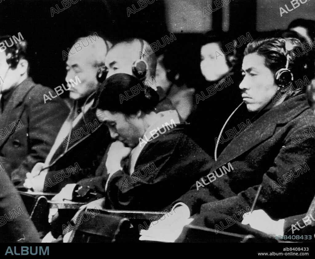 Tojo Weeps at Husband's Trial -- Mrs. Hideki Tojo bows her head and weeps during the trial in Tokyo, Japan of her husband, former premier of Japan, as Tojo is questioned by the prosecution. Others in the picture are unidentified. January 04, 1948. (Photo by AP Wirephoto).