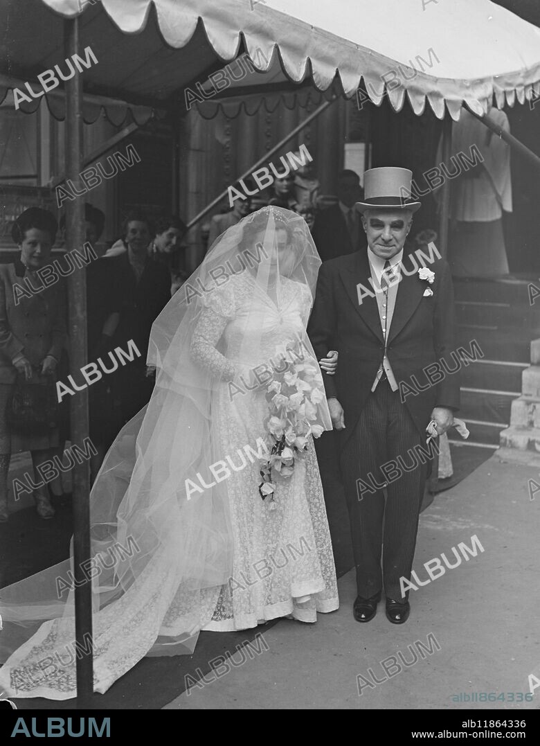MANSION HOUSE ROMANCE. Miss . PATRICIA WELLS, 25-year-old daughter of the Lord Mayor of London , Sir Frederick Wells- who will succeeded as Lord Mayor by Sir George Aylwen in November-was married to Mr . ALAN P . GREENAWAY , younger son of a former Lord Mayor , Sir Percy W Greenway at St . Michael's church Cornhill , London . Mr Greenaway who is 35 years old , is partner with his father and brother in their printing business . PICTURE SHOWS:- The bride arrives at the church on the arm of her father - Lord Mayor of London Sir Frederick Wells for her wedding . October 2 1948.