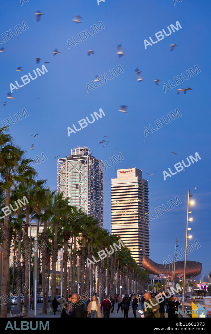 Paseo Maritimo de la Barceloneta, Mapfre Tower and Hotel Arts, Barcelona, Catalonia, Spain.