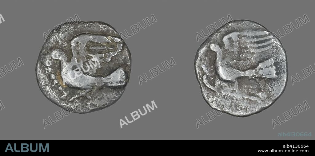 ANCIENT GREEK. Obol (Coin) Depicting a Dove. Greek. Date: 400 BC-323 BC. Dimensions: Diam. 1.1 cm; 0.72 g. Silver. Origin: Ancient Greece.